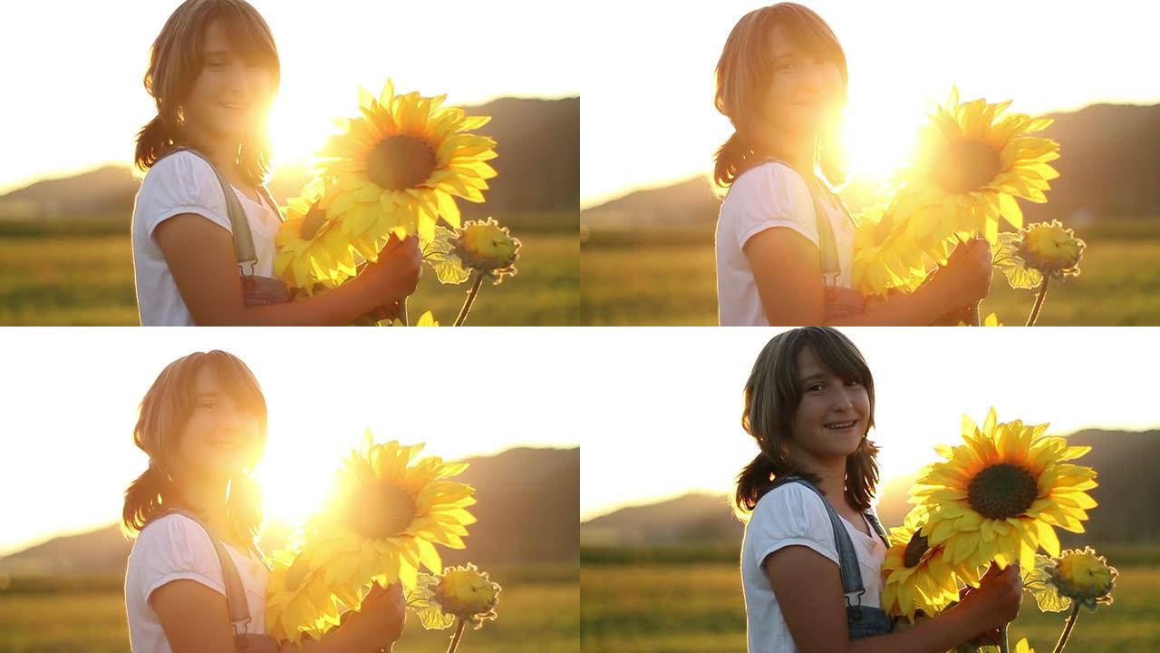 日落时分，年轻的女孩拿着向日葵