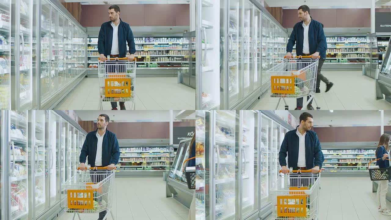 在超市: 帅哥推购物卡，在冷冻商品区浏览商品。后台的其他客户。