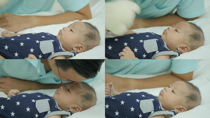 亚洲父亲爱抚婴儿的特写镜头