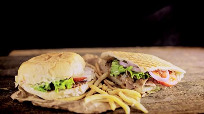 SLO MO DS汉堡包，炸薯条和烤肉串放在桌子上