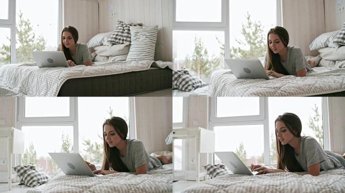 女人在卧室里使用笔记本电脑