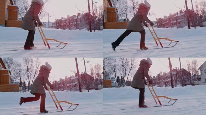 SLO MO女人在雪地里用踢腿雪橇