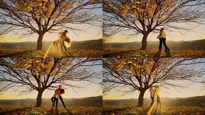 DS夫妇在日落时在树旁跳舞