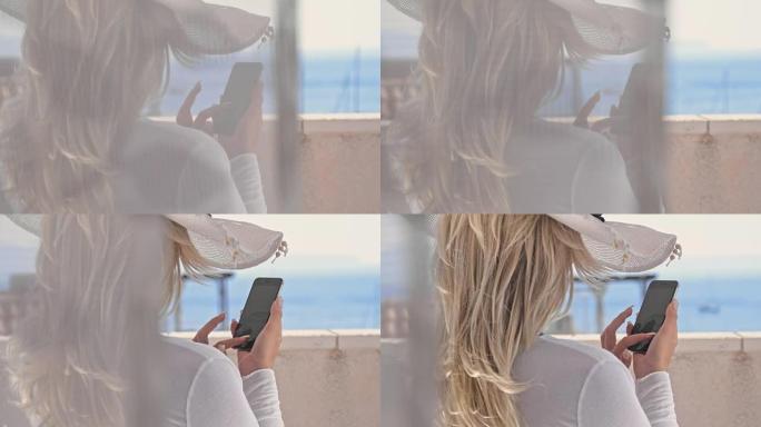 DS时尚女人在阳台上使用手机
