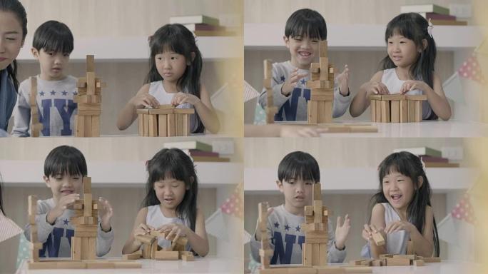 亚洲儿童建造木块男孩积木倒了