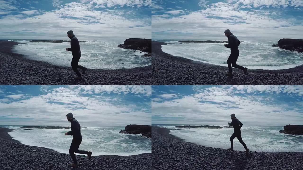 男子在岩石海滩上慢跑