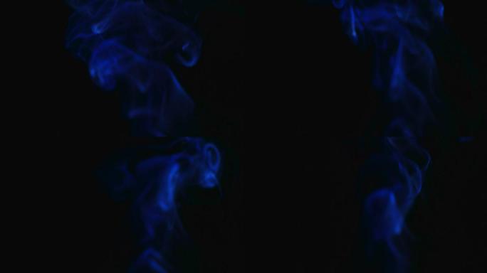 黑色背景上的蓝色烟雾