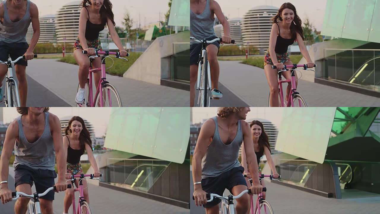 夫妇一起沿着城市街道骑自行车