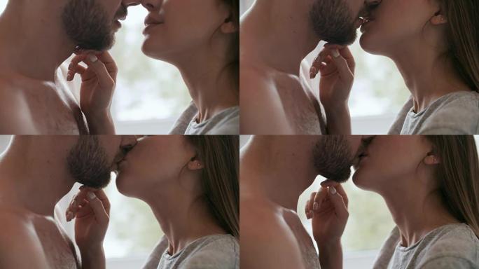 性感的女人亲吻男人的嘴唇