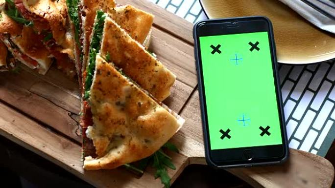 4K: 餐桌上的智能手机，绿屏