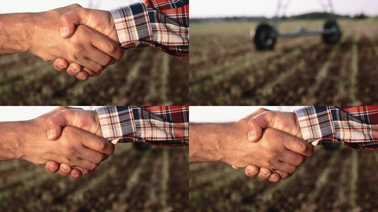 CU农民在田间握手