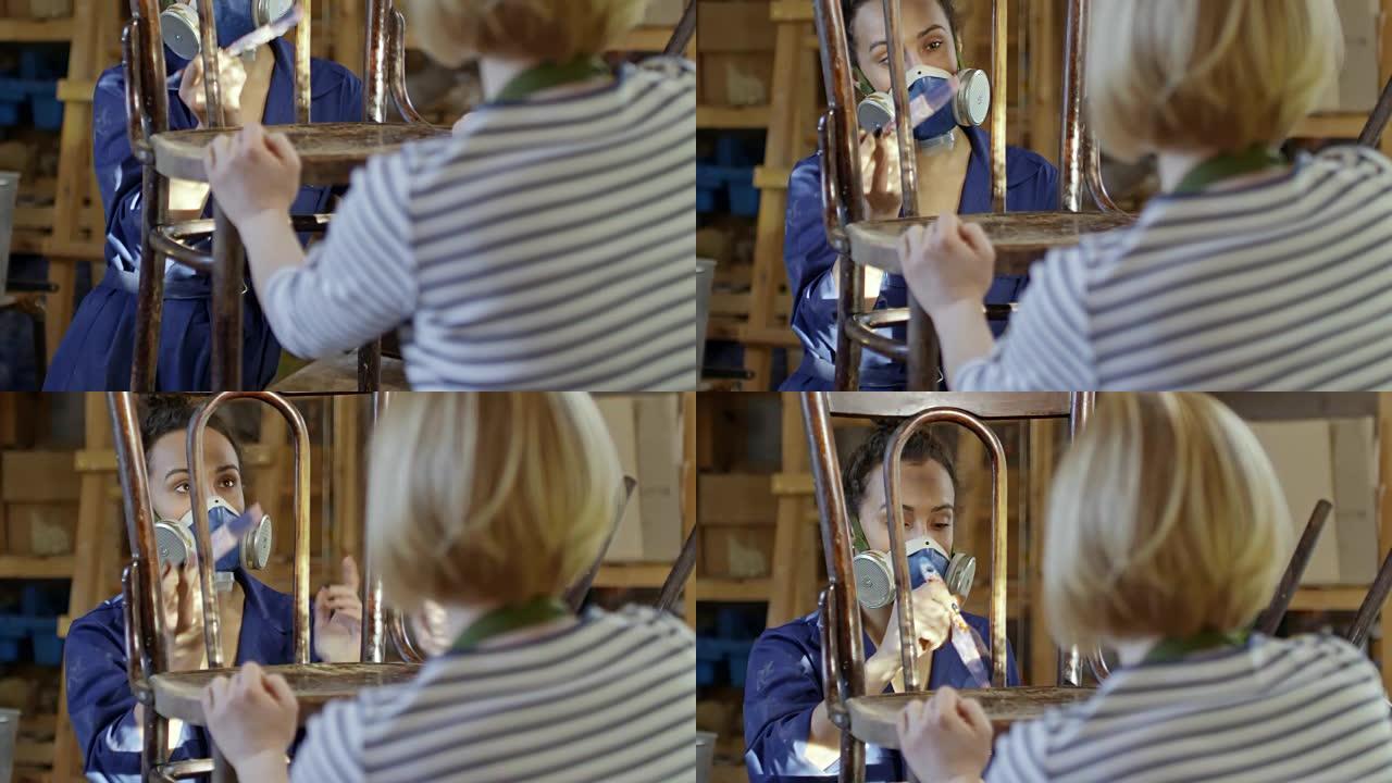 女性修补古董木椅油漆粉刷帮助