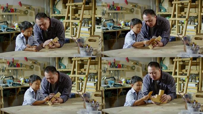 父亲教儿子如何使用砂纸