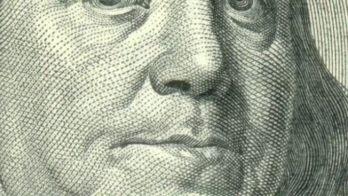 本·富兰克林在100美元钞票上眨眼的特写动画