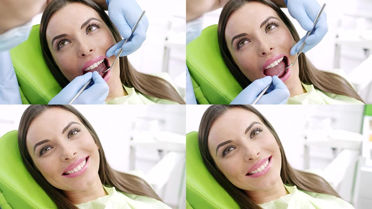 牙医的年轻女子牙医的年轻女子洁牙