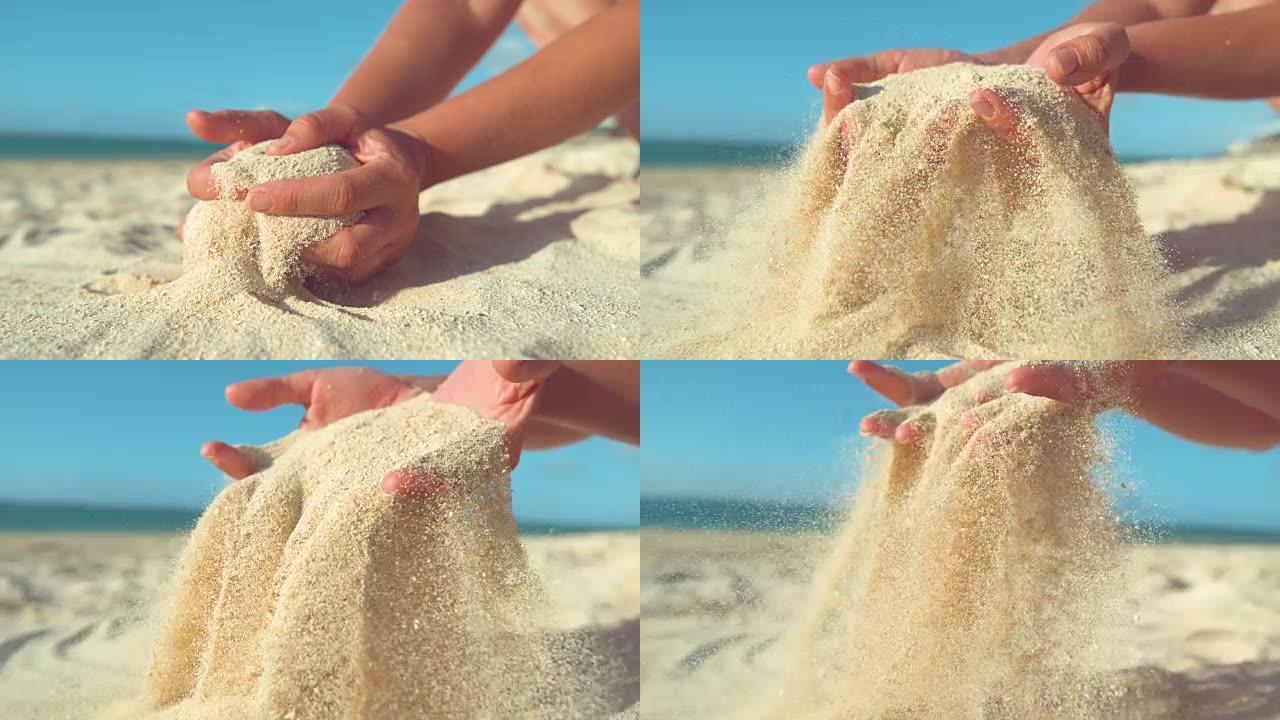 慢动作: 女人舀起一把沙子，在手指之间筛分。