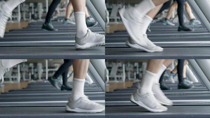 健身房里一个光着膀子的人，训练他的身体保持健康，并有明确的肌肉。运动员举起沉重的重量和乏力。