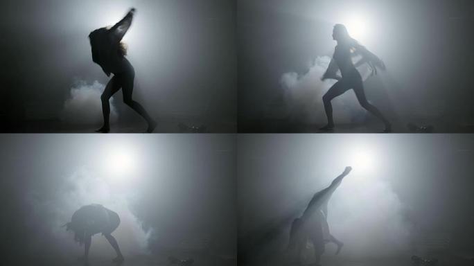 性感的女人在雾中激情跳舞