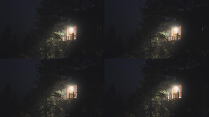 夜晚亮着灯光的小木屋