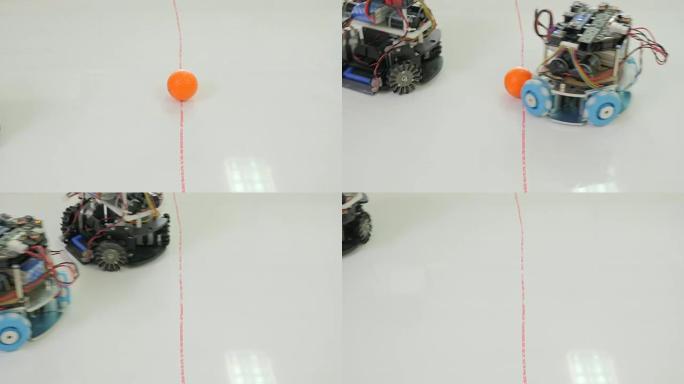 自主移动机器人踢足球。机器人踢足球或足球。机器人当人们踢球并进球时。