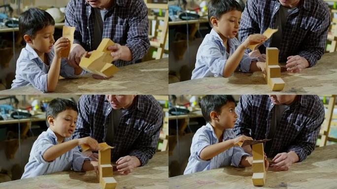 男孩打磨木制玩具男孩打磨木制玩具
