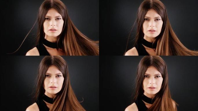 美丽的黑发女人扔掉她的长发