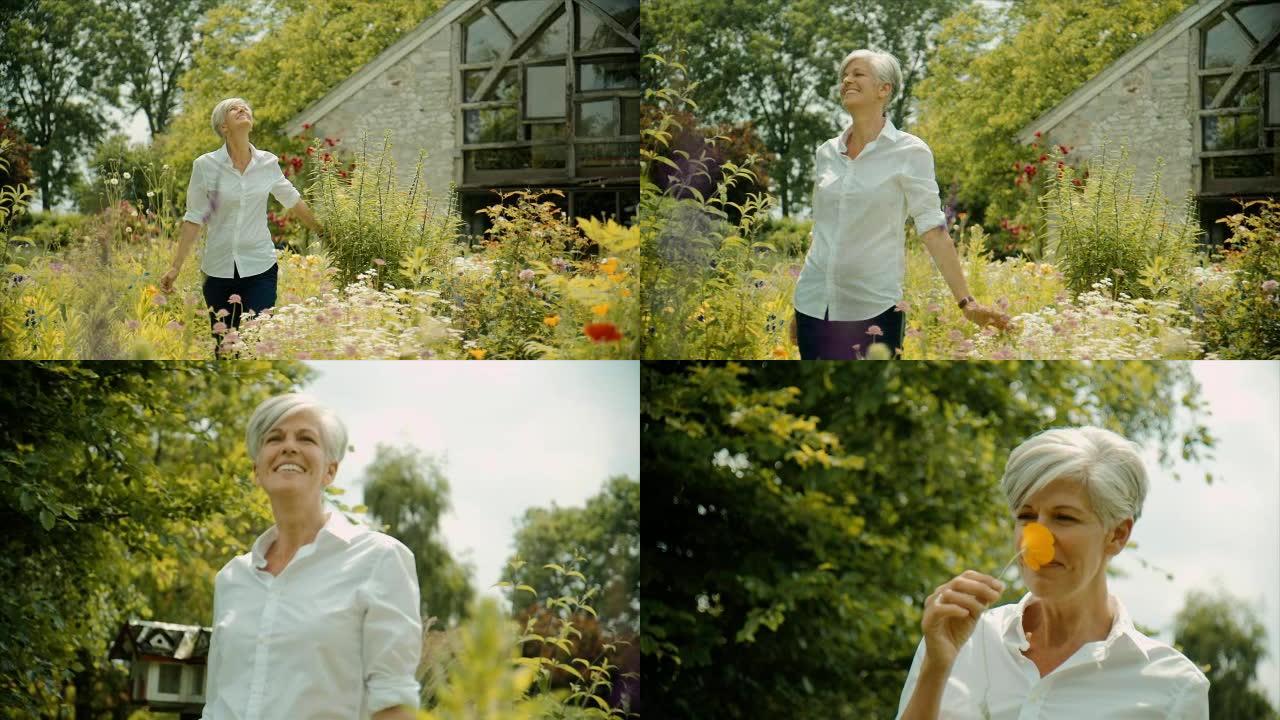 一位老妇人穿过花园，闻到花香