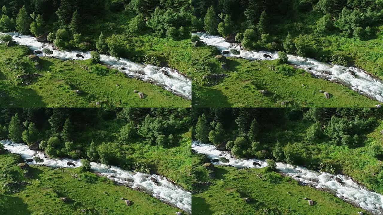 无人机在山上的溪流上方飞行