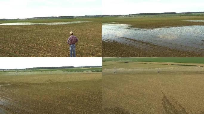 空中农民检查田间灌溉设备