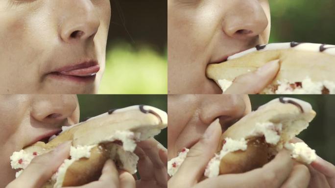 一个女孩吃奶油蛋糕的特写片段