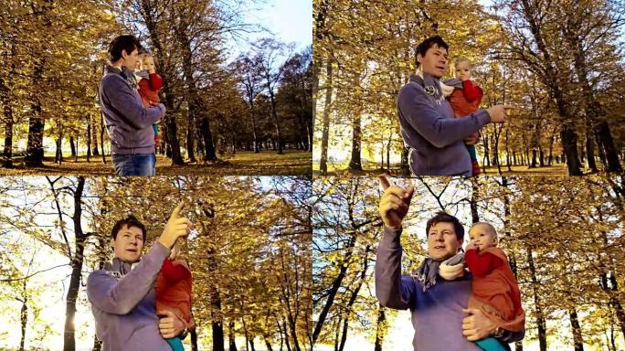 SLO MO父亲在秋季公园抱着女婴