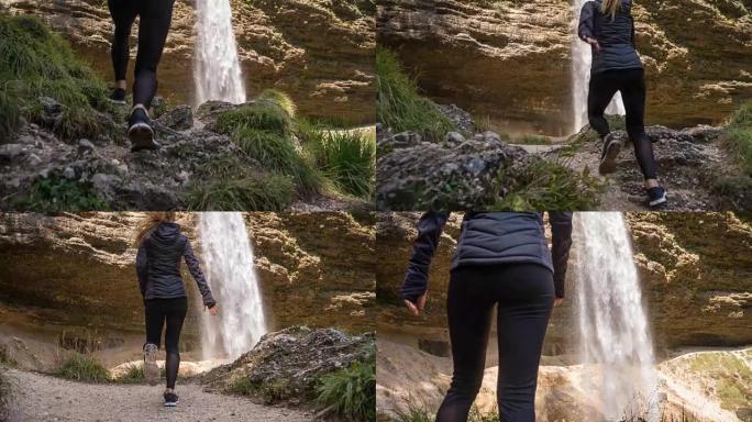 女人奔向瀑布，停在瀑布前