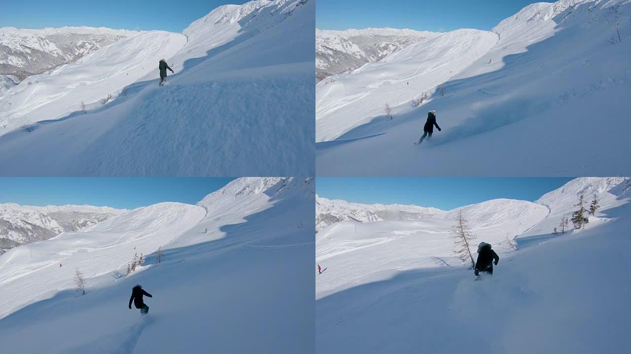 跟随: 滑雪板女孩从滑雪道上驶向滑雪胜地的山坡。