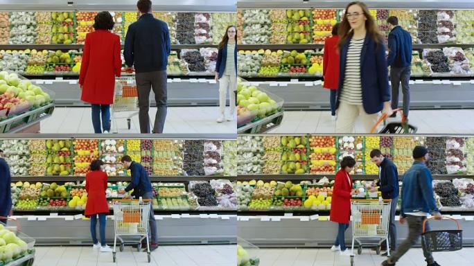 在超市: 幸福的年轻夫妇在商店的新鲜农产品区选择有机水果和浆果。男朋友推购物车，而女朋友拿水果。