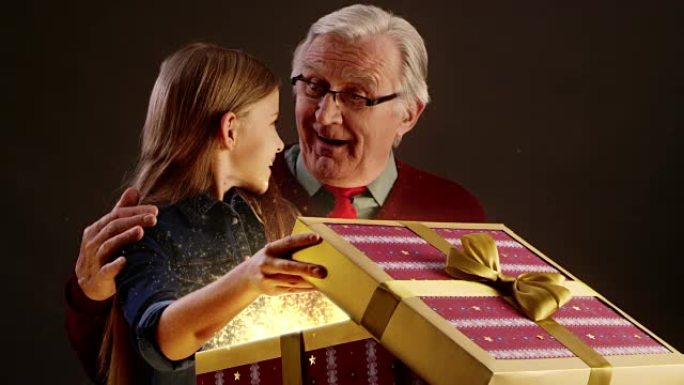 祖父和孙女打开圣诞礼物