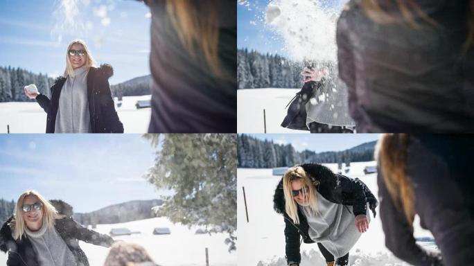 两个女人在打雪仗家庭日陪伴冰天雪地