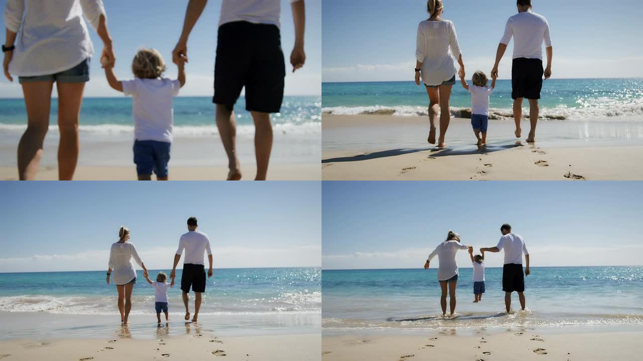 海滩上的家人海滩上的家人手拉手幸福一家