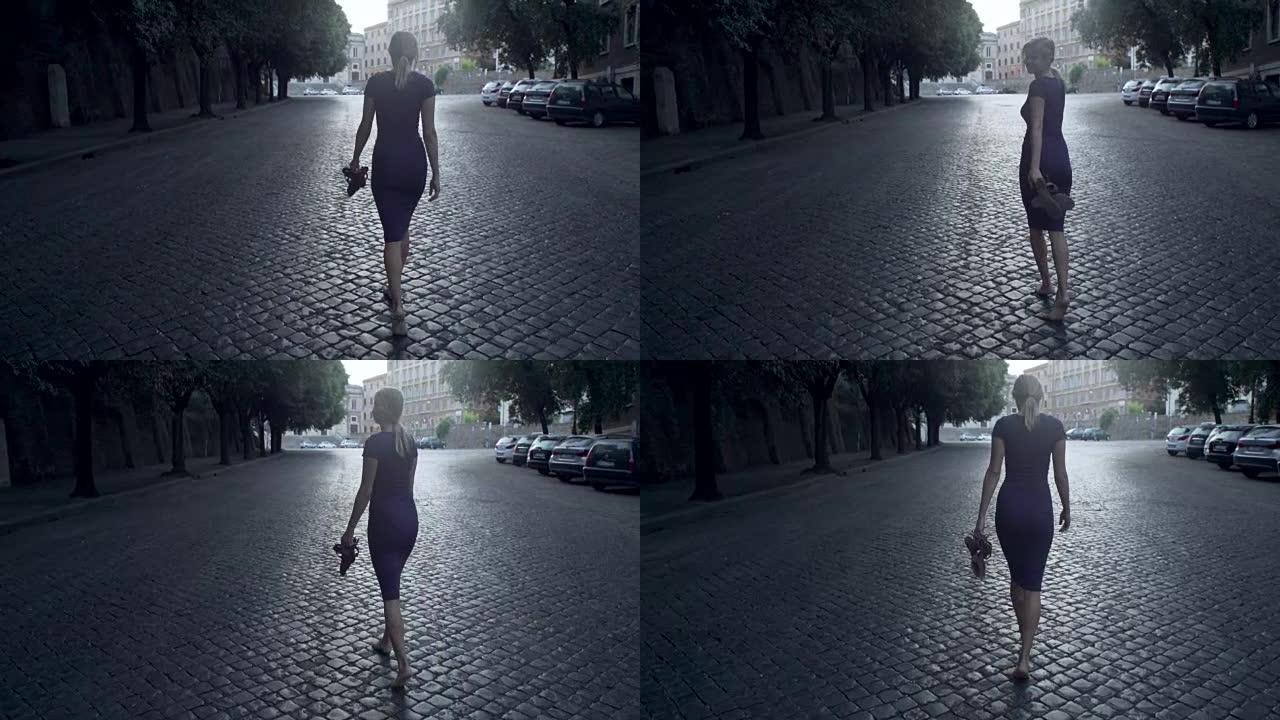 女人赤脚走在老城区的街道上