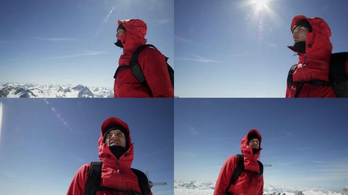 登山者在白雪覆盖的山峰上环视四周