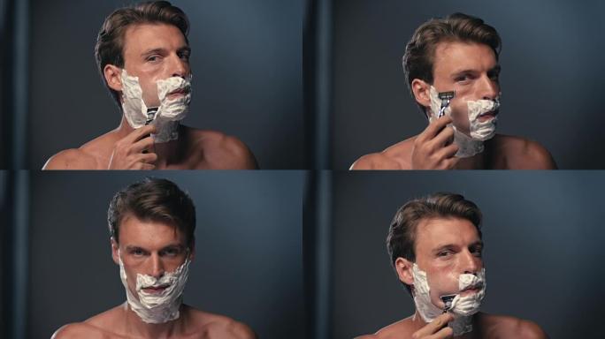 男人刮脸泡沫刮胡子早晨