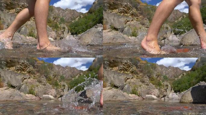 慢动作: 未知的赤脚男子横穿水晶般清澈的山脉溪流