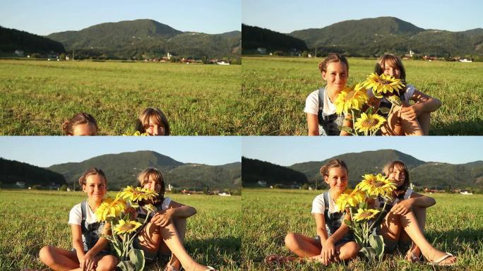开着向日葵的年轻女孩坐在草地上