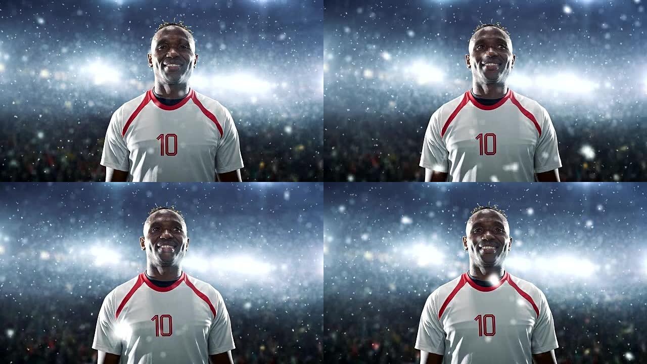 足球运动员庆祝胜利，并在下雪时站在专业体育场上微笑。