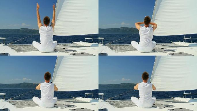 HD：年轻人在帆船上练习瑜伽