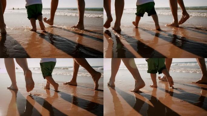 海滩上的家人实拍素材一家人漫步特写