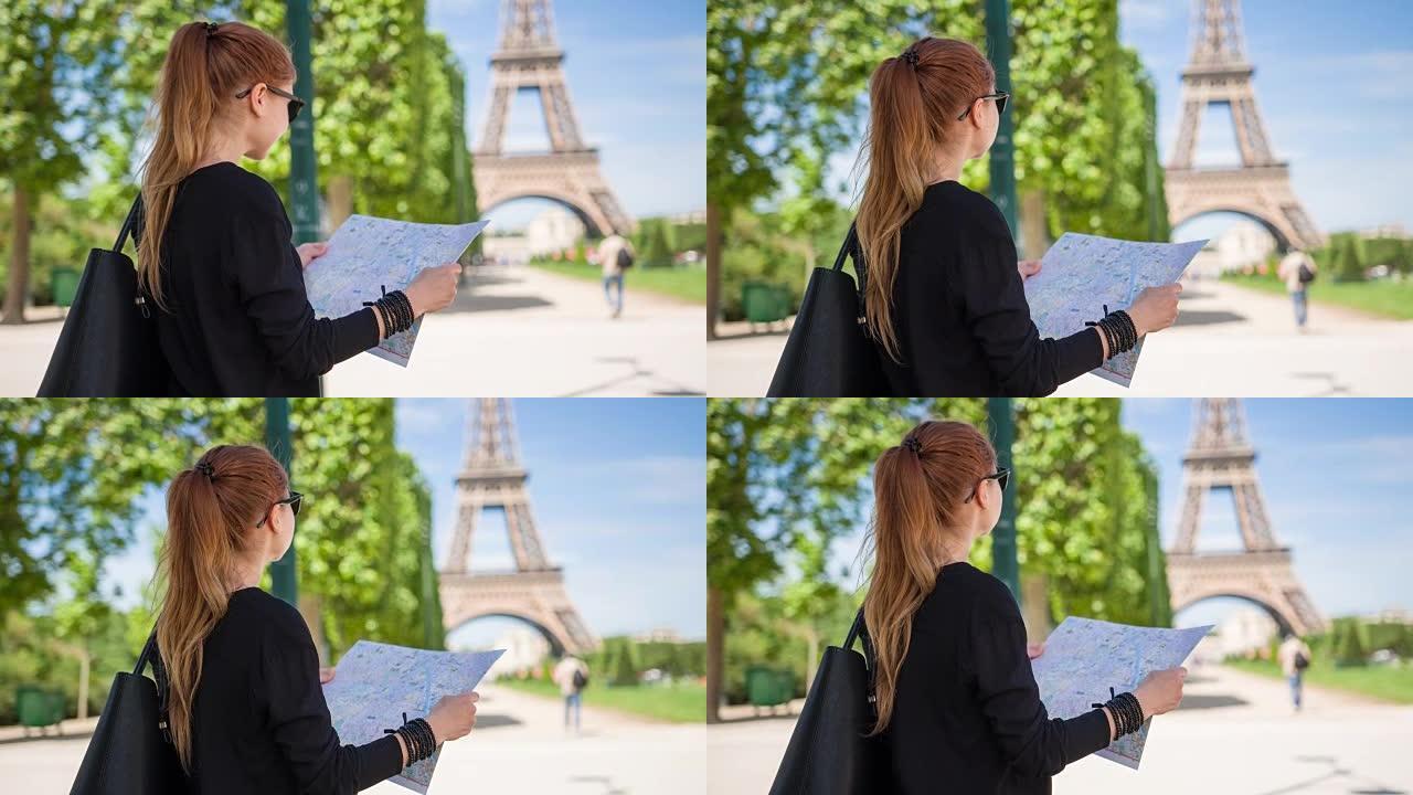女人跟随巴黎旅游景点地图，仰望埃菲尔铁塔