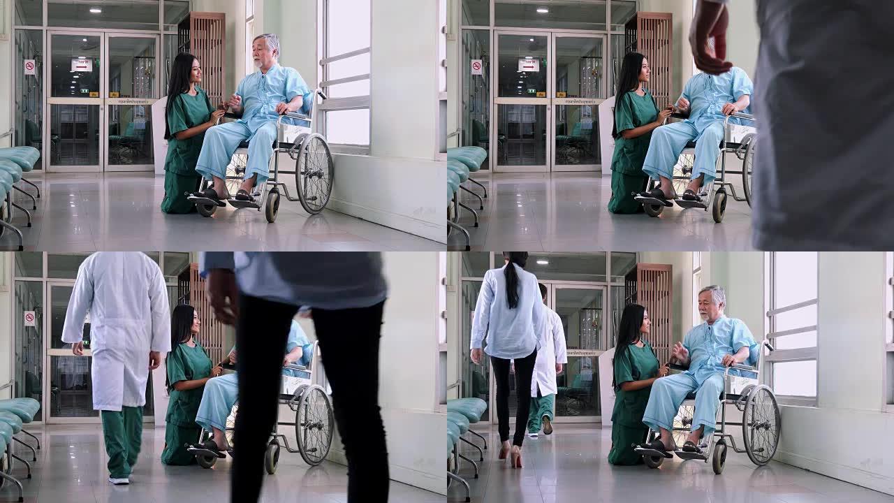护理护士在医院为老年男性患者提供支持。护士与轮椅上的老人交谈