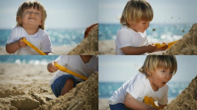 玩沙子的孩子海边儿童玩耍铲子玩沙