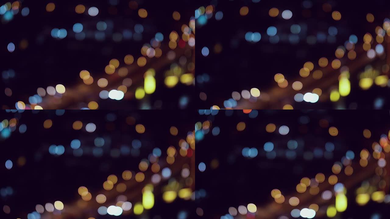 曼谷市的夜间交通信号灯散焦