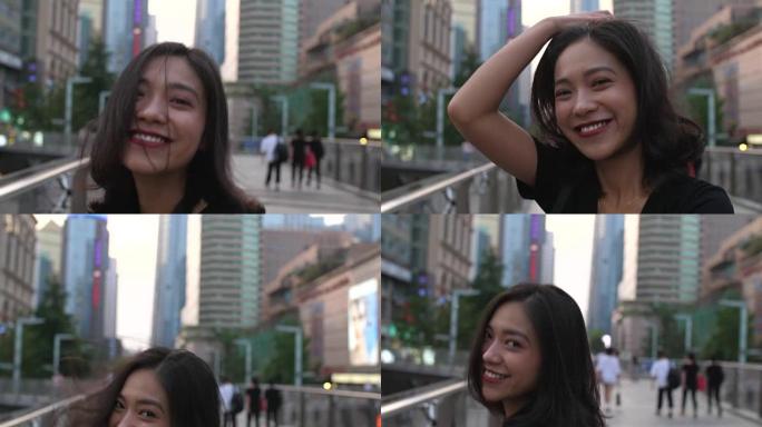 可爱的亚洲女孩对着镜头微笑。